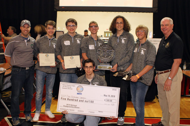 NRL winning team group image holding check of 500 dollars